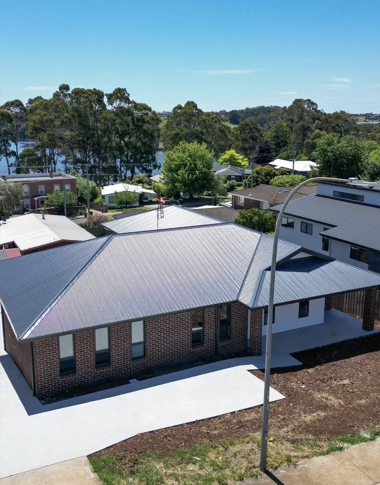 exterior image of the building looking towards a nearby lake